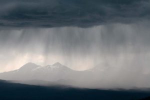 Thunderstorm clouds and virga rain over the Three Sisters, Three Sisters Wilderness, Willamette National Forest, Oregon, USA